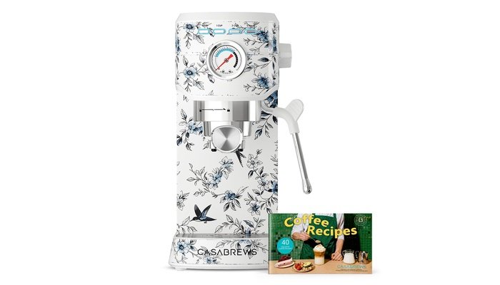 CASABREWS CM5418 stainless steel espresso machine on marble countertop with fresh espresso